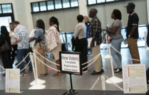 People wait to vote in early voting for the midterm elections on October 25 in Cary