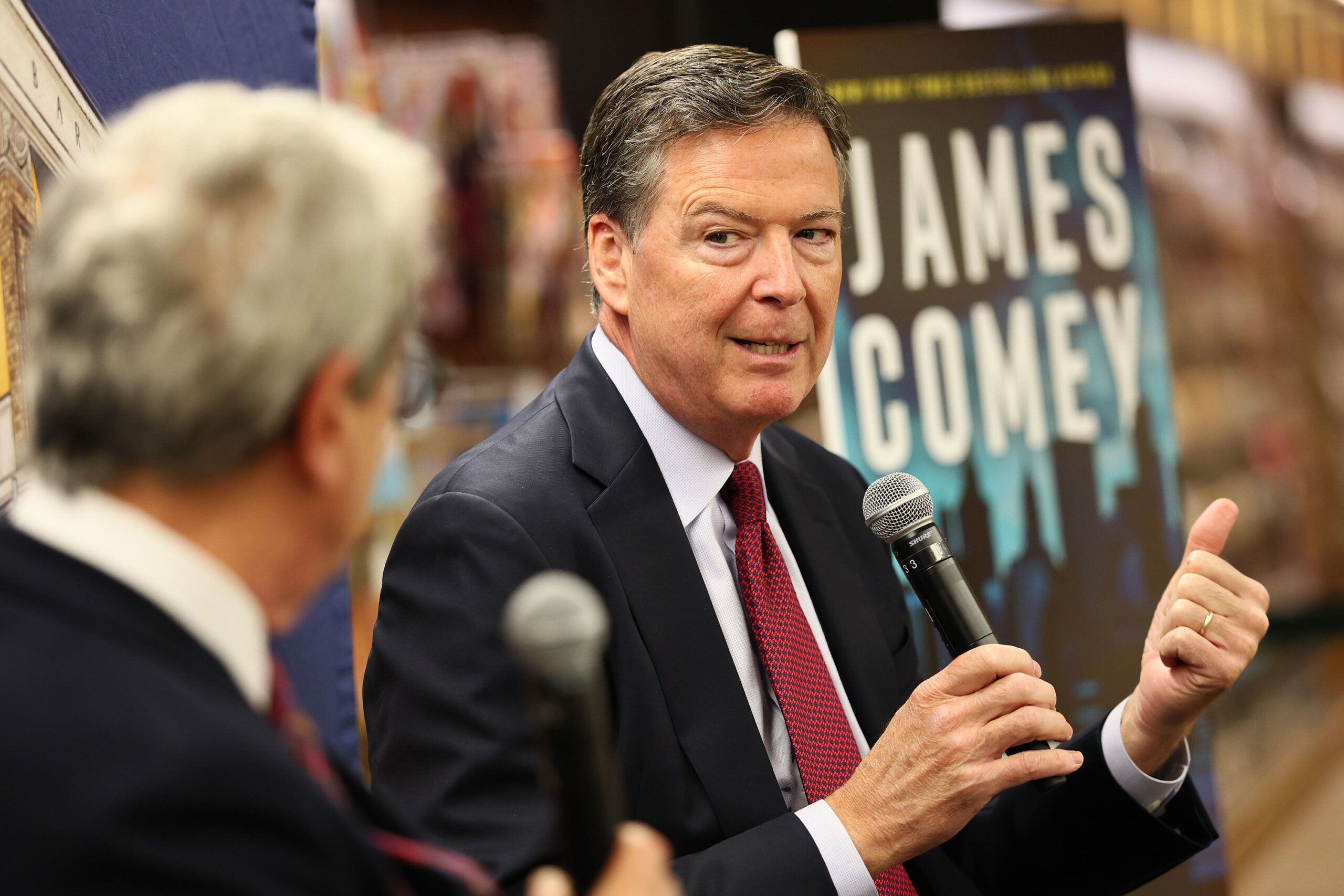 <i>Michael M. Santiago/Getty Images via CNN Newsource</i><br/>Former FBI Director James Comey speaks at the Barnes & Noble Upper West Side in New York