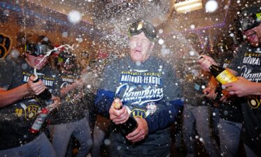 The Cleveland Guardians' Steven Kwan celebrates in the clubhouse after defeating the Chicago White Sox to advance to the American League Championship Series.