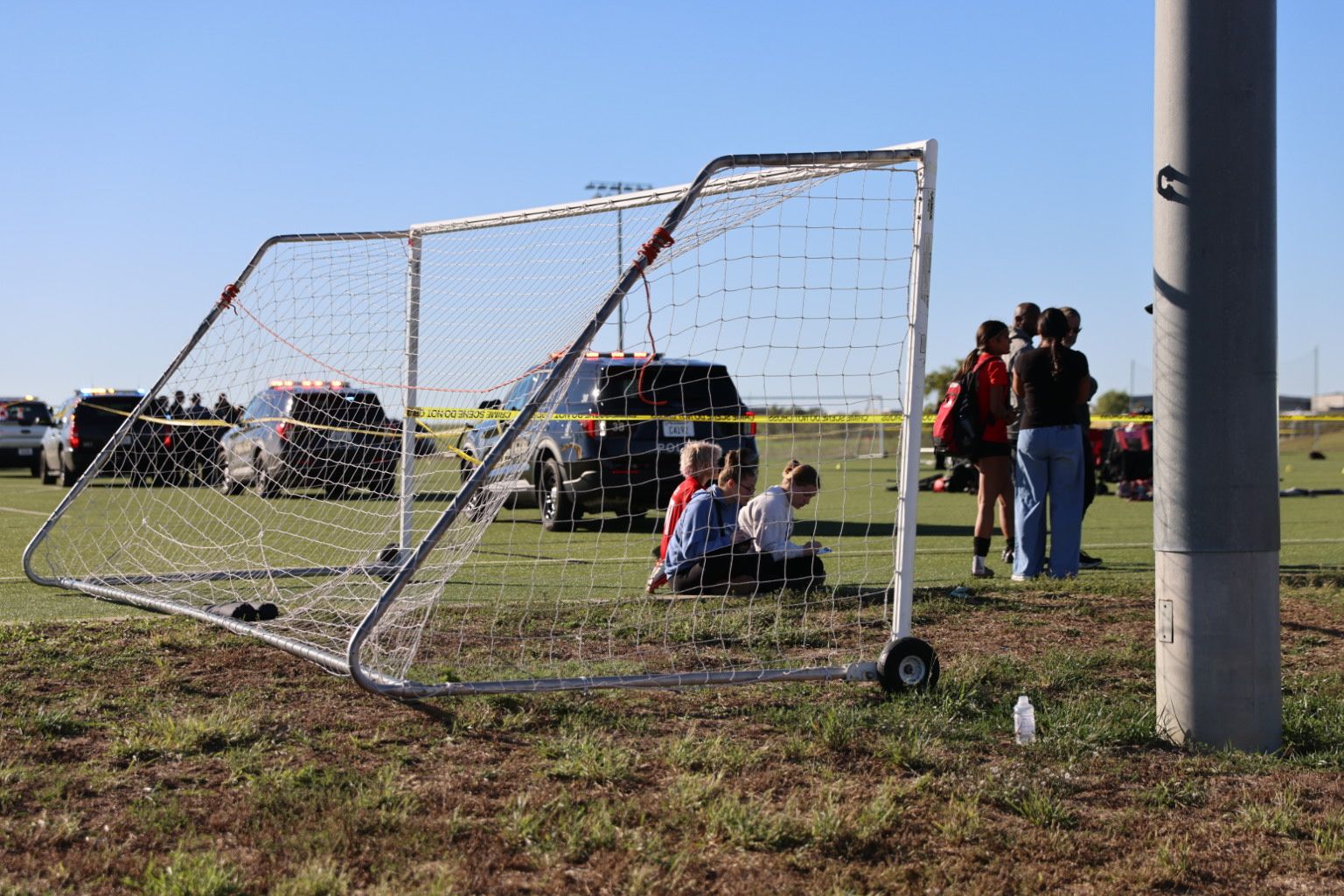 <i>Wyatt Glosson/KAKE-TV/AP via CNN Newsource</i><br/>This image provided by KAKE shows police on the scene where a person drove a vehicle through a soccer field during a game in Wichita