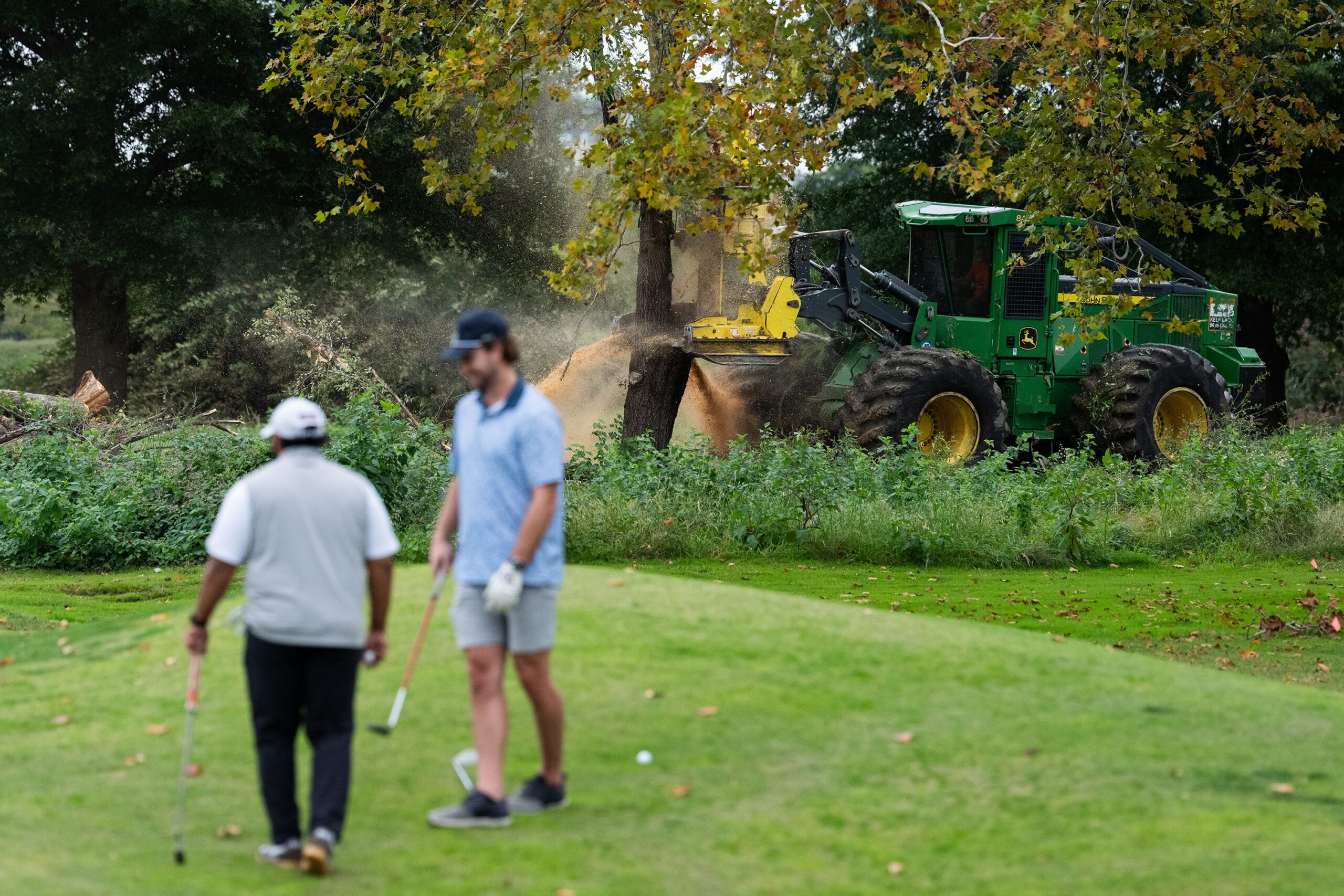 <i>Aaron Schwartz/Getty Images via CNN Newsource</i><br/>Crews cut down trees on East Potomac Golf Course as golfers continue to use the course in Washington