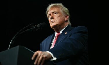 US President Donald Trump speaks during a campaign rally at the Heartland Credit Union Arena in Park City