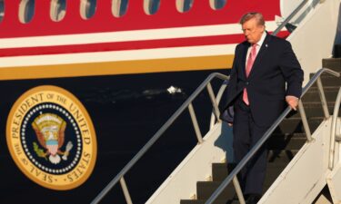 President Donald Trump steps off Air Force One at McConnell Air Force Base on October 19