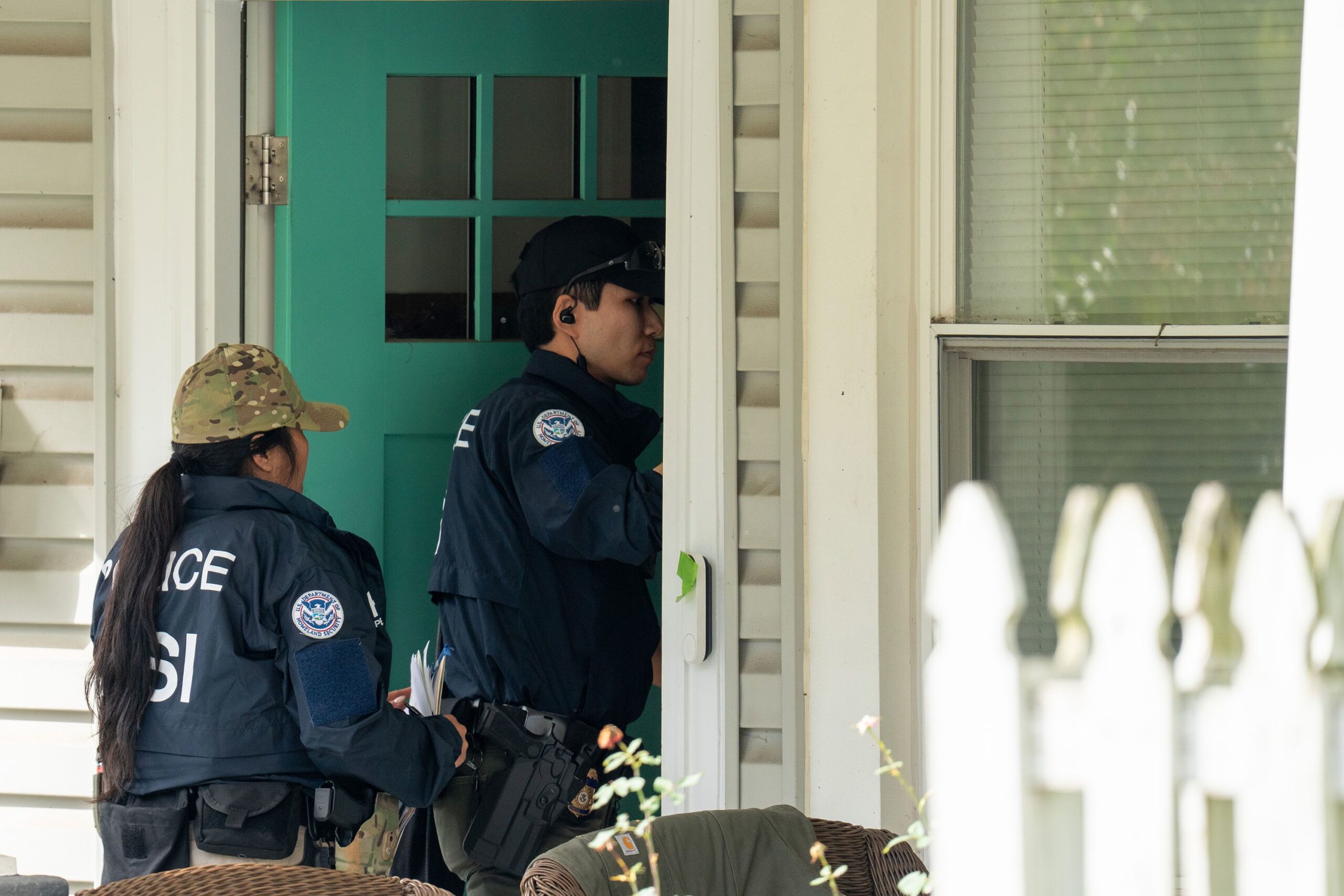 <i>Andrew Leyden/Getty Images via CNN Newsource</i><br/>Homeland Security Investigations police search the home of Rep. Ilhan Omar in Washington
