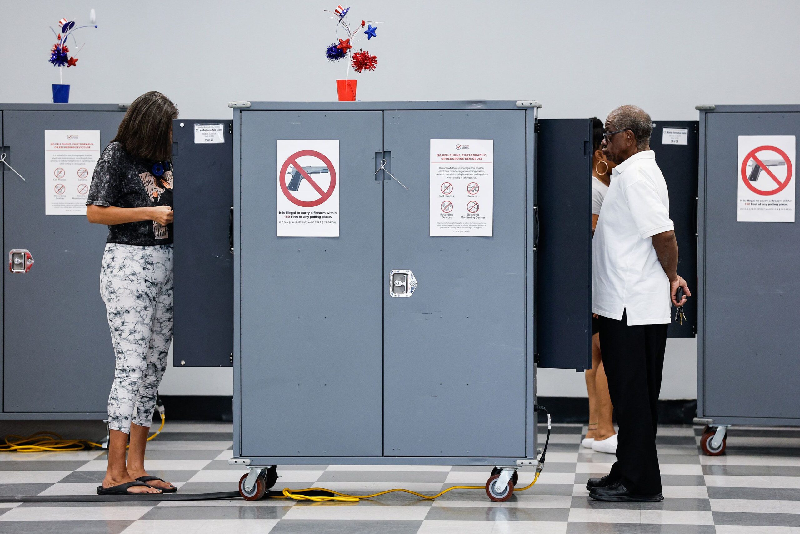 <i>Erik S. Lesser/AFP via Getty Images via CNN Newsource</i><br/>People vote in Atlanta on October 13.