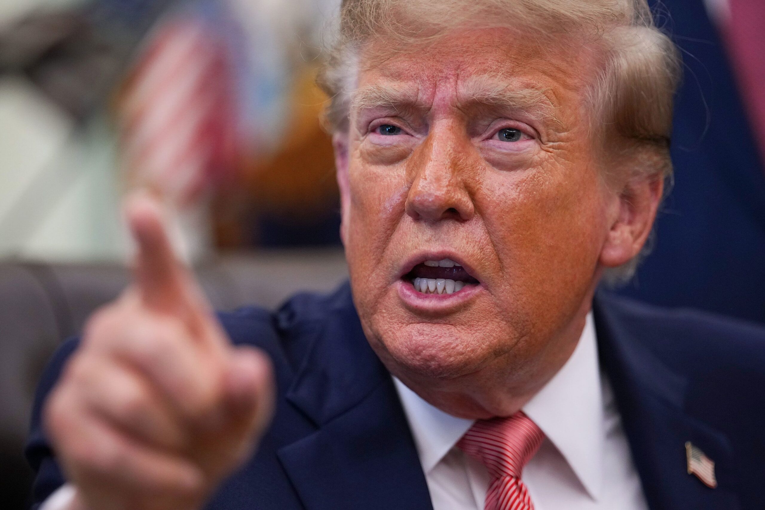 <i>Andrew Harnik/Getty Images via CNN Newsource</i><br/>President Donald Trump gestures as he speaks to reporters in the Oval Office of the White House.