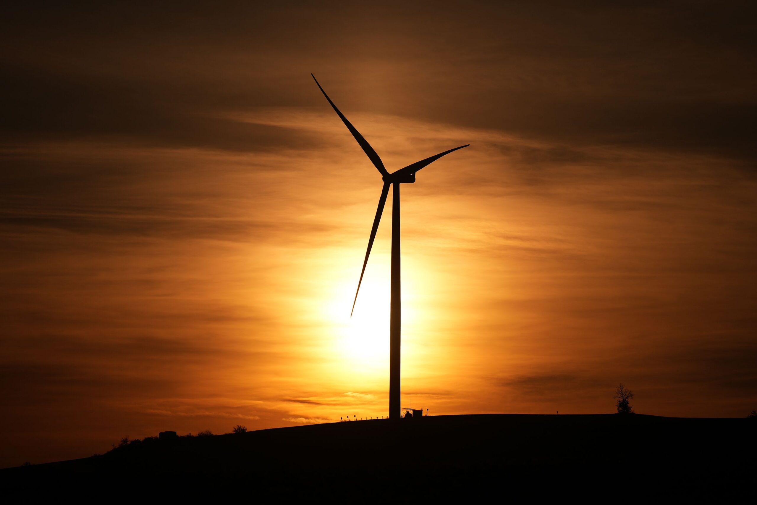 <i>Emrah Gurel/AP via CNN Newsource</i><br/>A wind turbine generates electricity at sunset in Balabanli