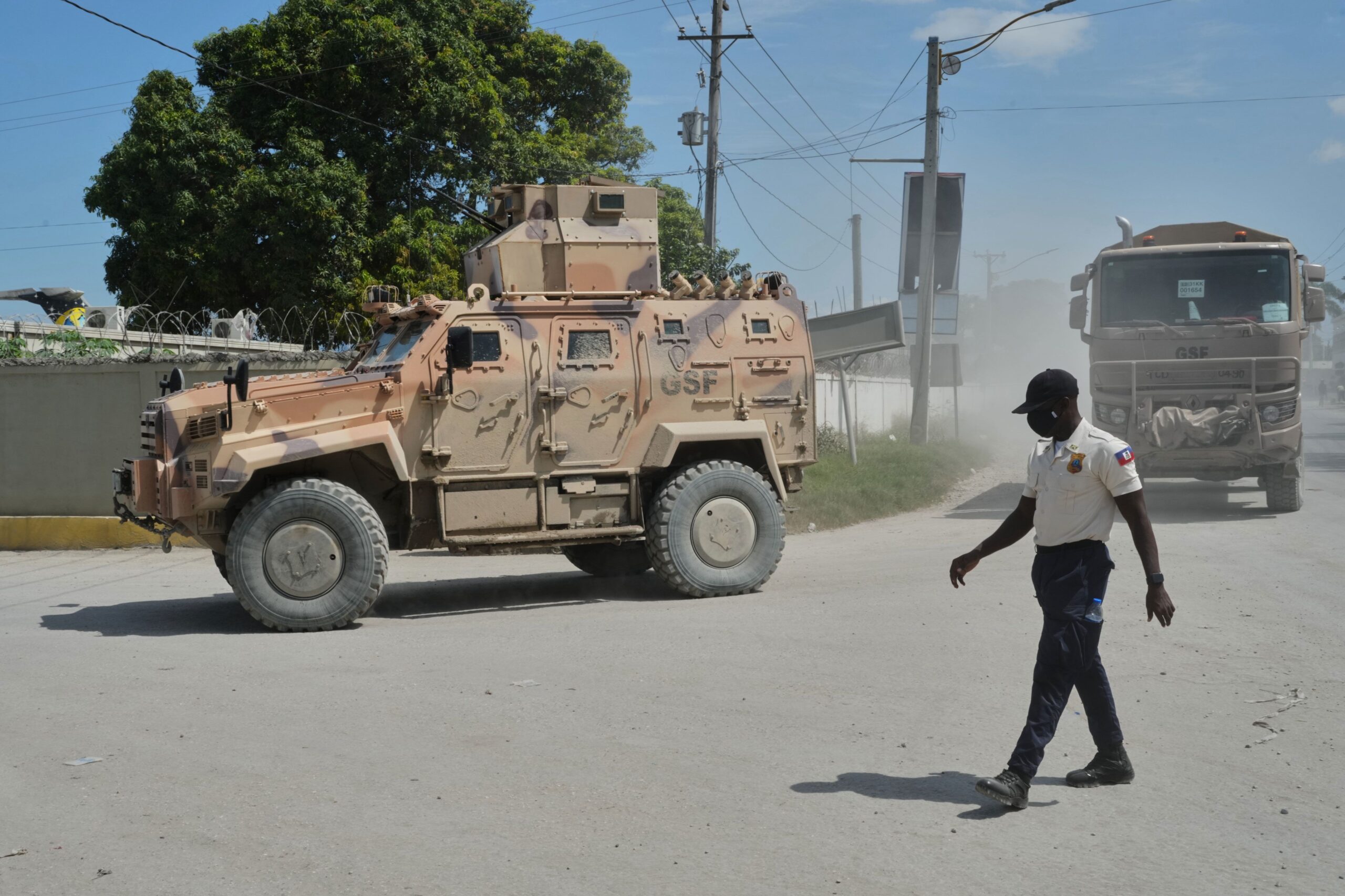 <i>Odelyn Joseph/AP via CNN Newsource</i><br/>Armored police vehicles that are part of the Gang Suppression Force (GSF) patrol near the airport in Port-au-Prince