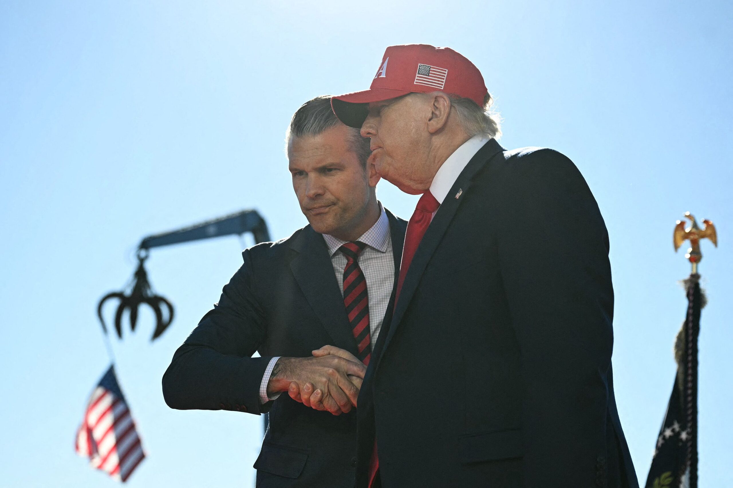 <i>Jim Watson/AFP/Getty Images via CNN Newsource</i><br/>US President Donald Trump (R) shakes hands with Secretary of Defense Pete Hegseth as he arrives to speak at Anduril Industries in Sparrows Point